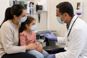 Parent and child visiting an urgent care provider for respiratory symptoms during RSV season